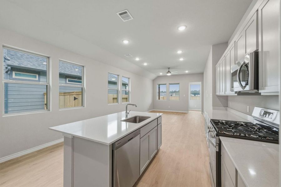 Kitchen in the Cedar home plan by Trophy Signature Homes – REPRESENTATIVE PHOTO
