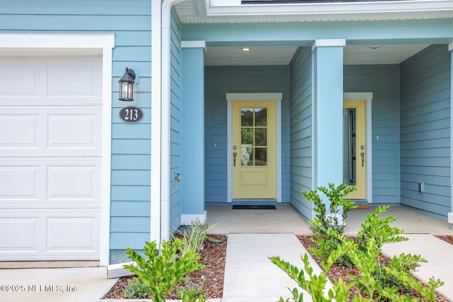 Front exterior of a new home in The Hammock at Palm Harbor, Palm Coast, FL, highlighting curb appeal (Image 1).