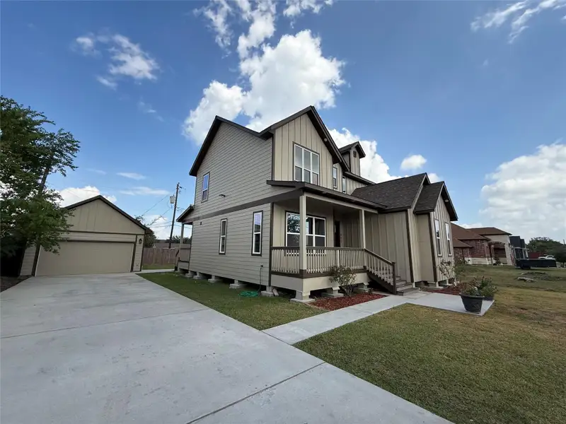 Front exterior of a new home in , Pasadena, TX, highlighting curb appeal (Image 2).