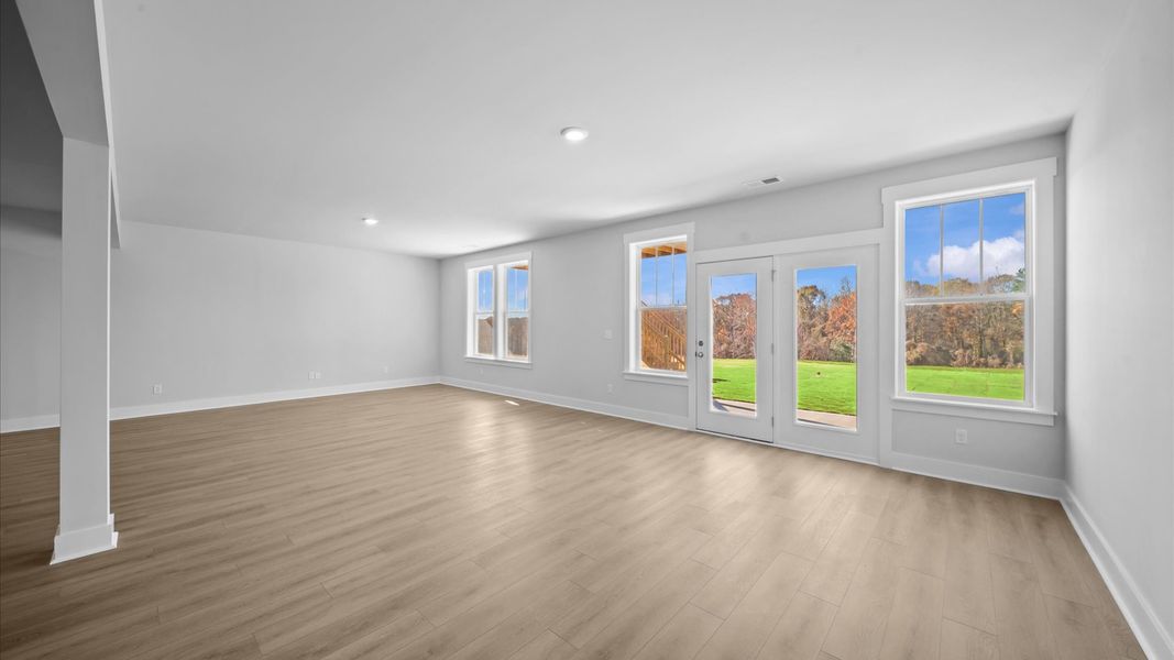 Hardwood flooring and high standards define this vibrant basement ideal for everyday living