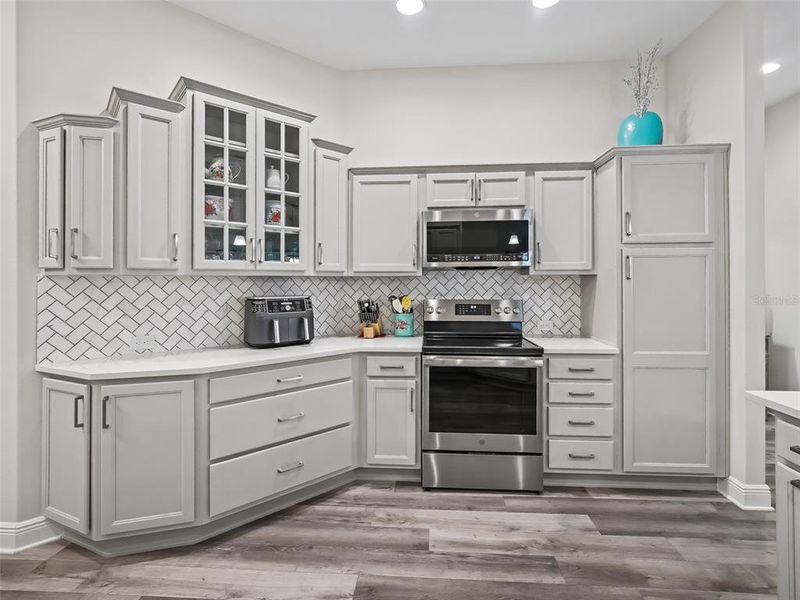 Kitchen with quartz counter tops and Marble backsplash in herringbone pattern