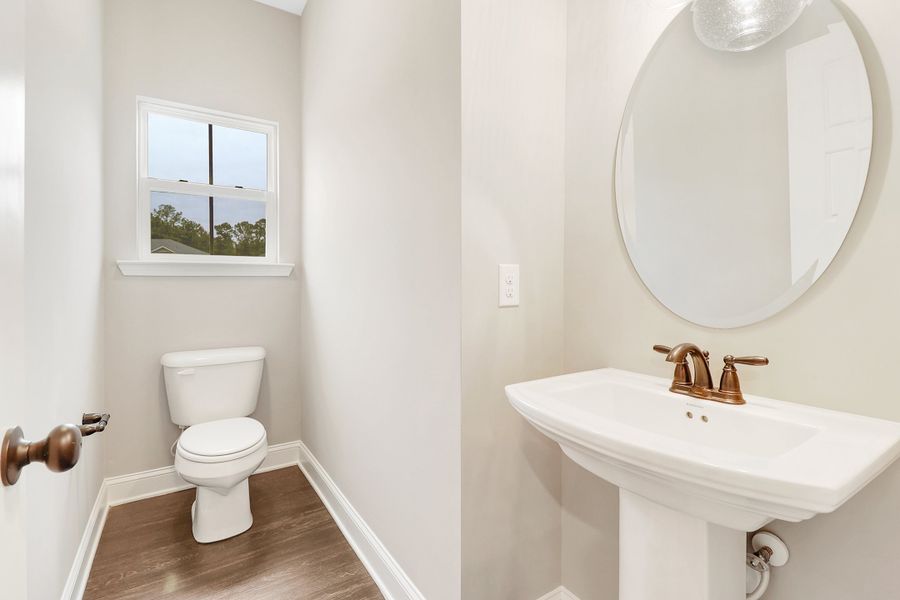 Edisto Powder Room with Pedestal Sink and Natural Light