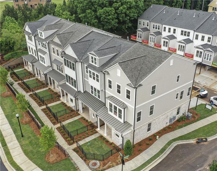Front exterior of a new home in Devin's Shire - A Kennesaw Tradition, Kennesaw, GA, highlighting curb appeal (Image 24).