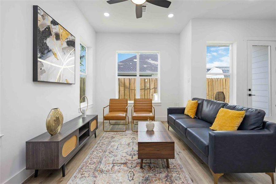Within minutes of all Heights has to offer! This 3 bedroom, 3 full bath, and one half bath home in a gated community has a beautiful modern elevation and large windows that bring in ample natural light throughout the home.