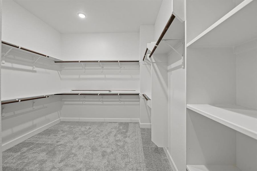 Oversized Master closet is every person's dream!  With the 10 ft ceilings you can even add more off-season hanging space!