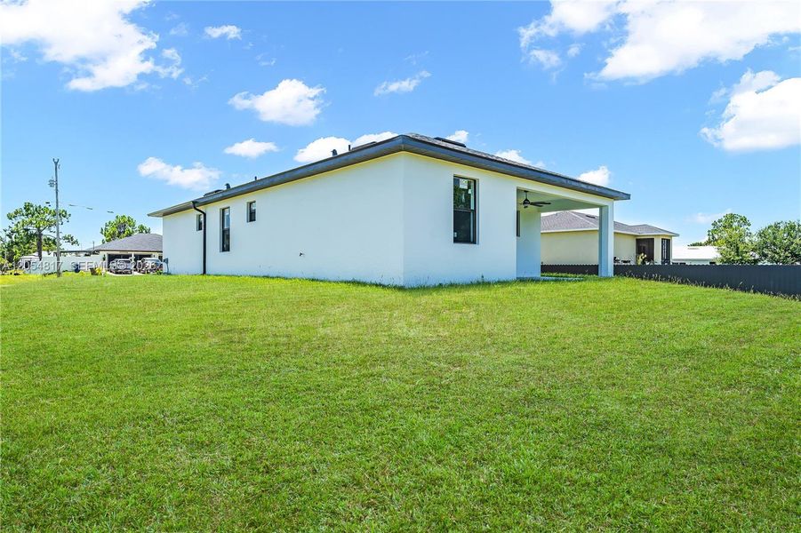 Exterior details and patio area of a home in , Lehigh Acres (Image 24). Exterior details and patio area of a home in , Lehigh Acres (Image 24).