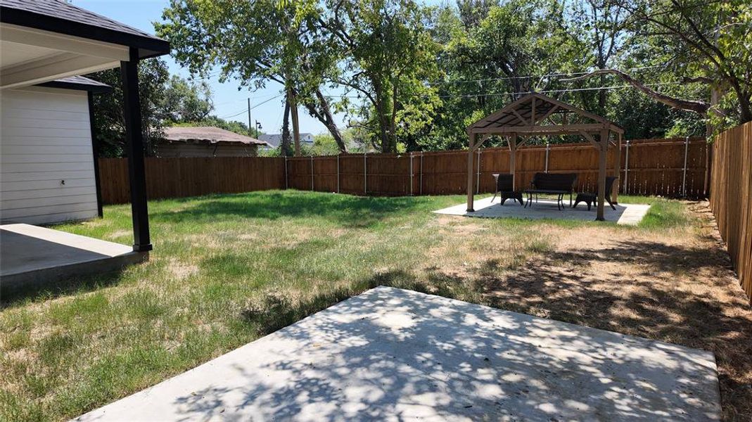 View of yard with a patio and a gazebo