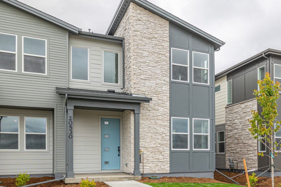 Front exterior of a new home in Painted Prairie, Aurora, CO, highlighting curb appeal (Image 22).
