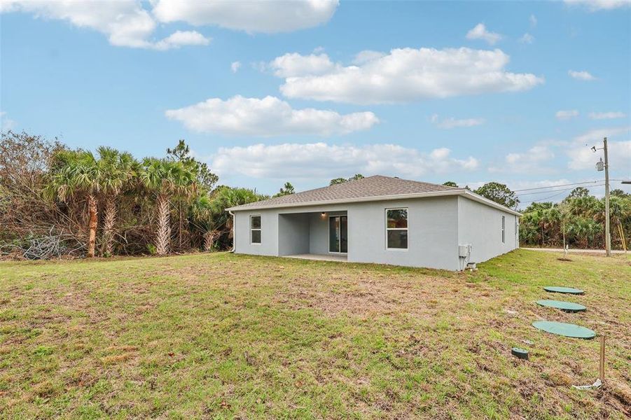 Exterior details and patio area of a home in Palm Bay Classic, Palm Bay (Image 20).