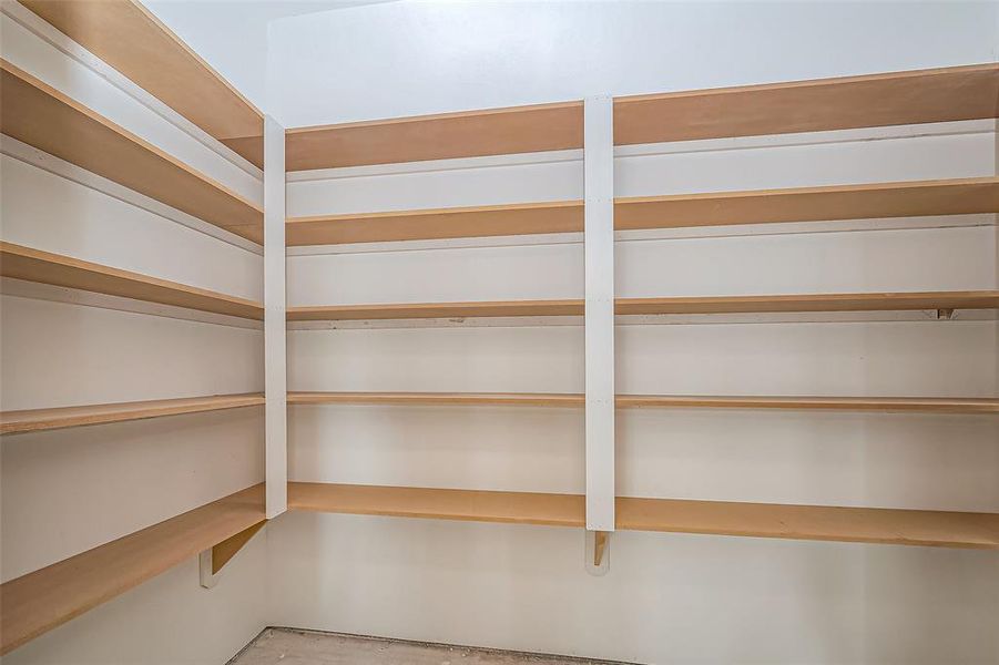 Generously sized with layered shelving, this pantry will provide abundant storage, keeping ingredients and kitchen essentials within easy reach.