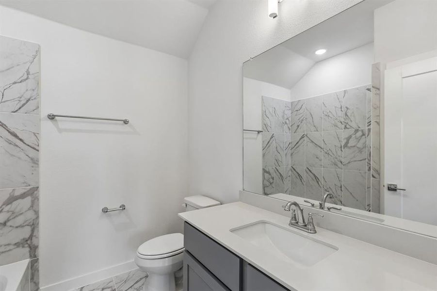 Bathroom in the Claret home plan by Trophy Signature Homes – REPRESENTATIVE PHOTO
