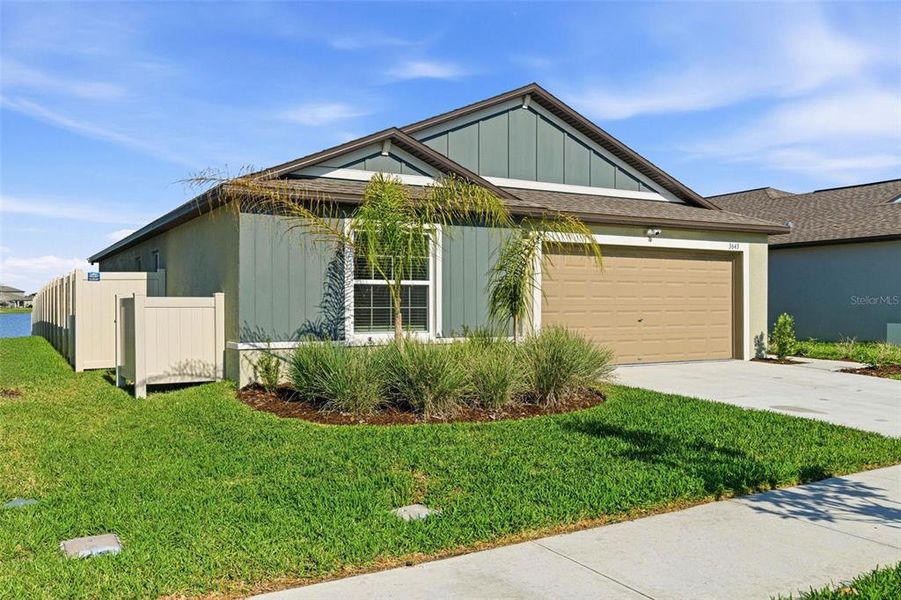 Front exterior of a new home in North Park Isle, Plant City, FL, highlighting curb appeal (Image 2).