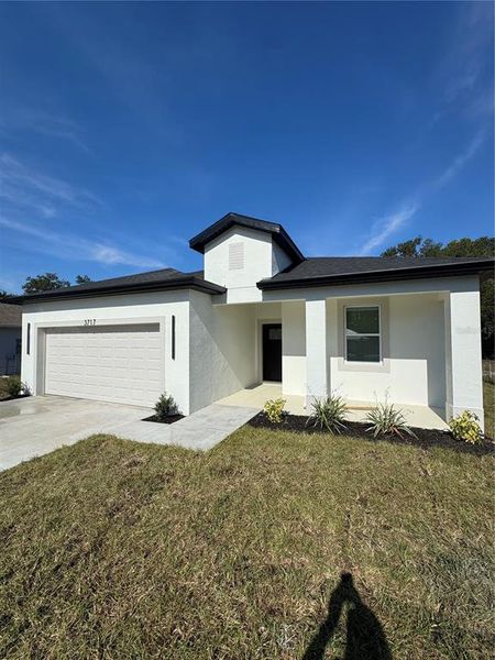Front exterior of a new home in , Lake Wales, FL, highlighting curb appeal (Image 19). Front exterior of a new home in , Lake Wales, FL, highlighting curb appeal (Image 19).