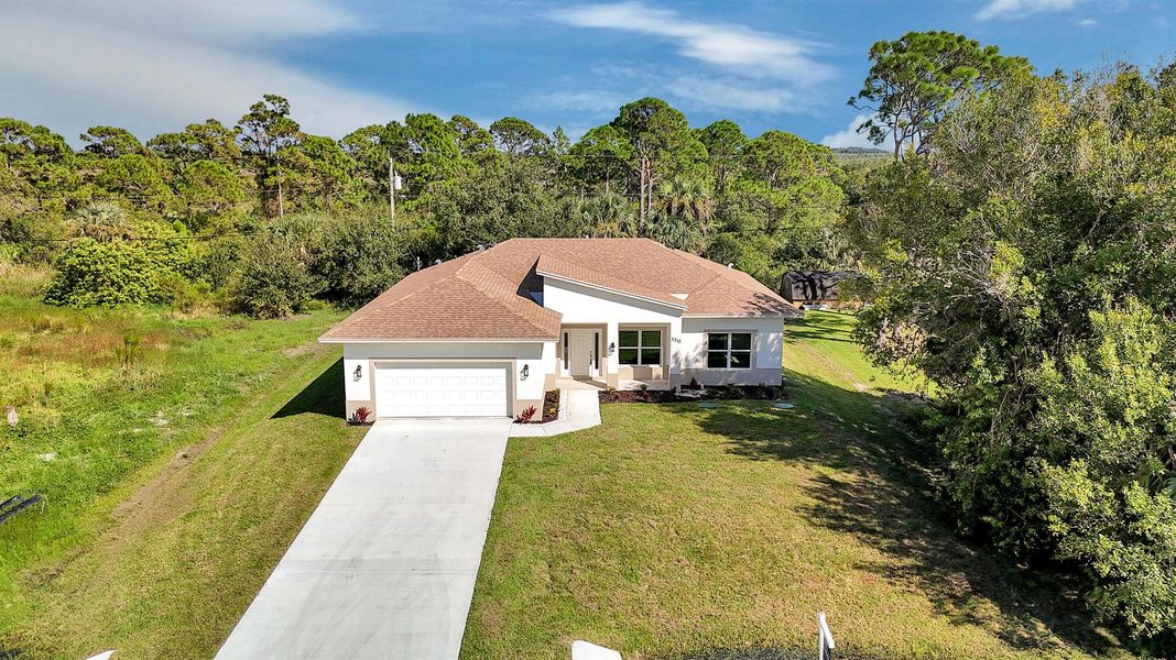 Front exterior of a new home in , Fort Pierce, FL, highlighting curb appeal (Image 27).