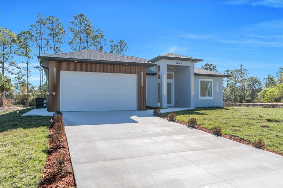 Front exterior of a new home in , Lehigh Acres, FL, highlighting curb appeal (Image 15).