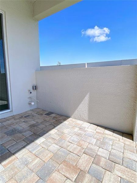 Exterior details and patio area of a home in Valencia Ridge (55+), Wesley Chapel (Image 18).