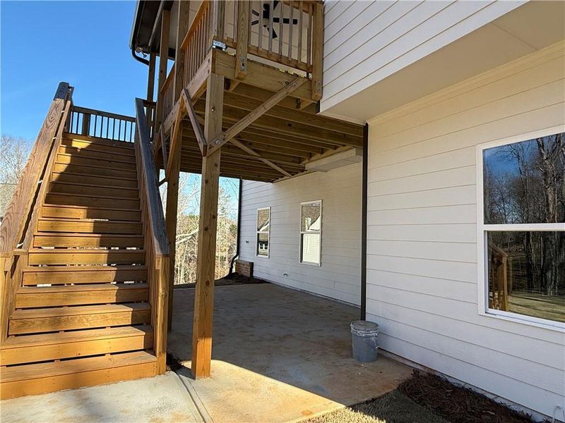 Exterior details and patio area of a home in River Rock, Ball Ground (Image 28).