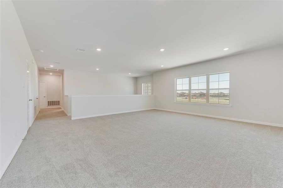 Spacious, unfurnished interior of a new home in Valencia On The Lake, Little Elm (Image 21).