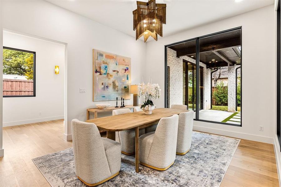 The dining area sits comfortably next to the kitchen and living room, making it easy to host everything from casual dinners to larger gatherings without feeling tucked away