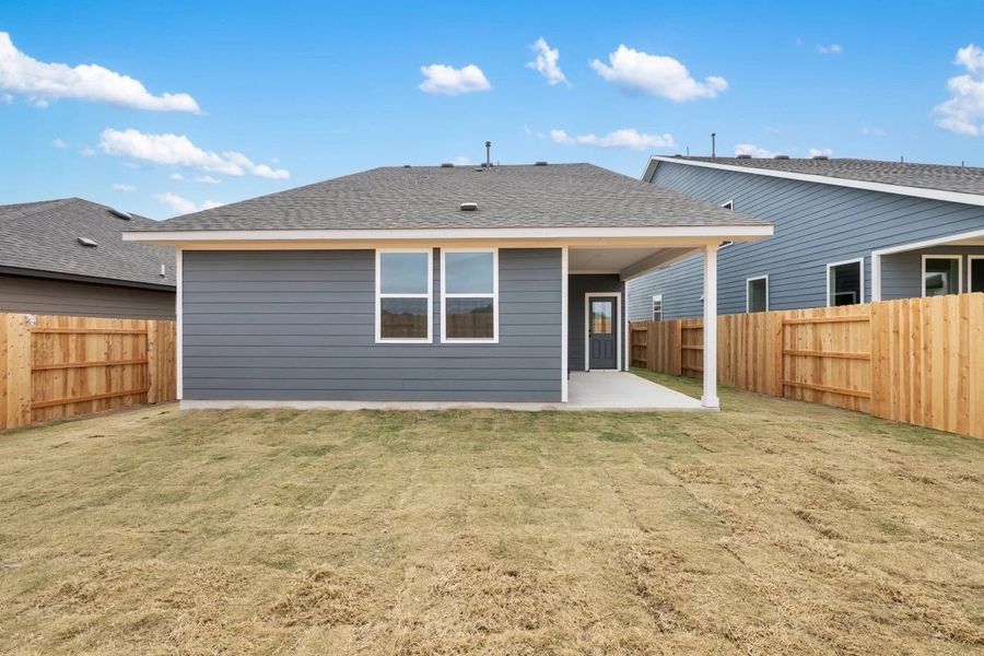 Exterior details and patio area of a home in Lariat, Liberty Hill (Image 26).