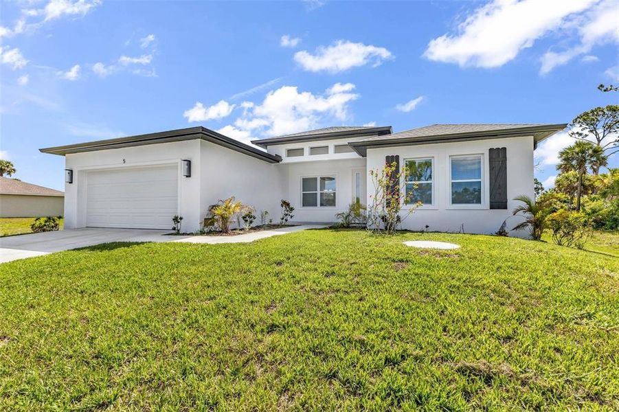 Front exterior of a new home in , Placida, FL, highlighting curb appeal (Image 25).