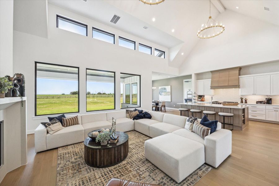 Living Area with cathedral ceiling, on-trend chandeliers, and clerestory windows - allowing in tons of natural light! Living Area with cathedral ceiling, on-trend chandeliers, and clerestory windows - allowing in tons of natural light!