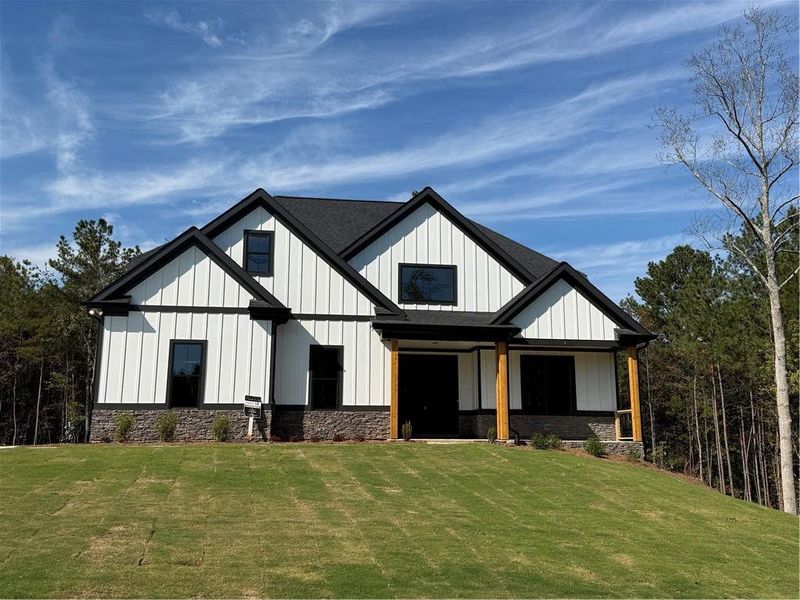Front exterior of a new home in , Waleska, GA, highlighting curb appeal (Image 1).