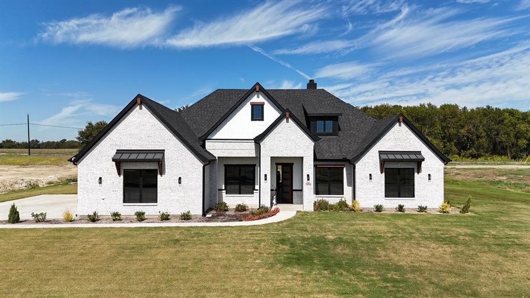 Front exterior of a new home in Capitol Hill, Anna, TX, highlighting curb appeal (Image 12). Front exterior of a new home in Capitol Hill, Anna, TX, highlighting curb appeal (Image 12).