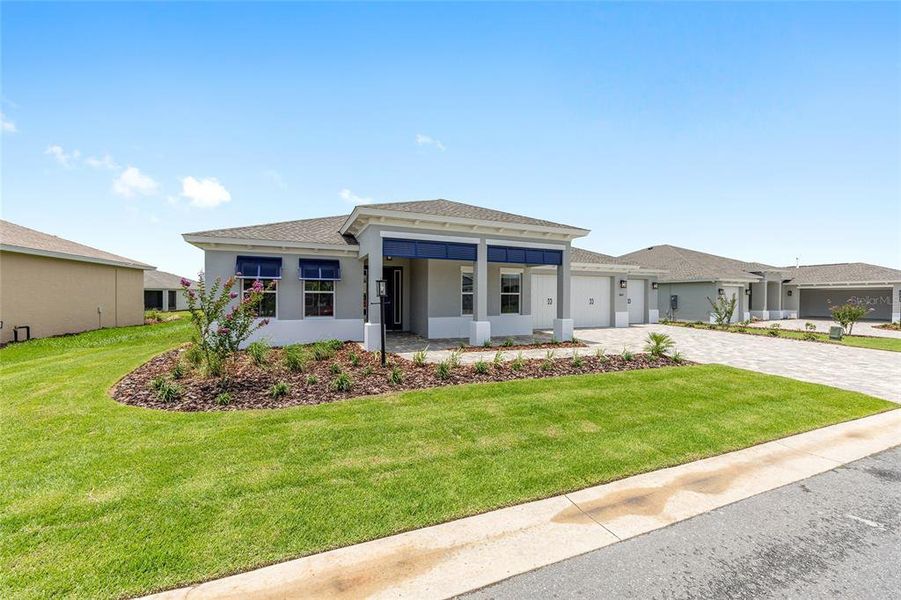 Front exterior of a new home in On Top of the World Communities, Ocala, FL, highlighting curb appeal (Image 11).