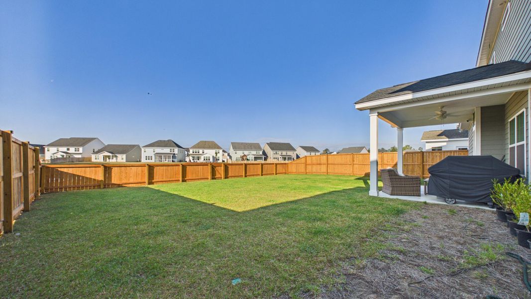 Exterior details and patio area of a home in Hewing Farms, Summerville (Image 4).