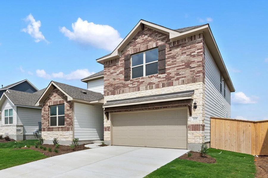 Front exterior of a new home in Patterson Ranch, Georgetown, TX, highlighting curb appeal (Image 2). Front exterior of a new home in Patterson Ranch, Georgetown, TX, highlighting curb appeal (Image 2).
