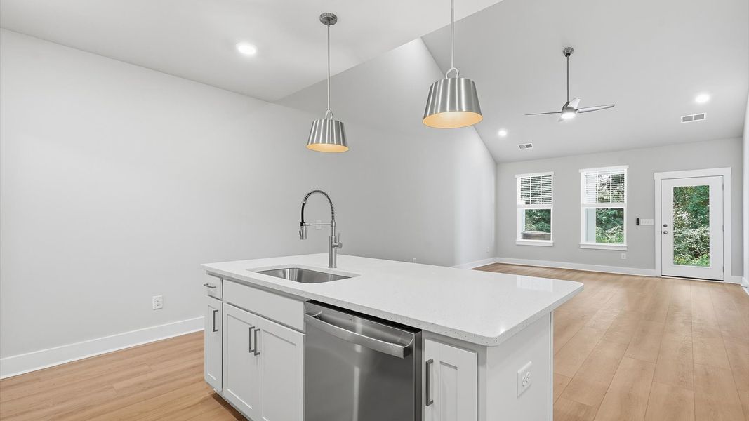 Accomplished layout with a first-class kitchen in this select townhome community by DRB Homes