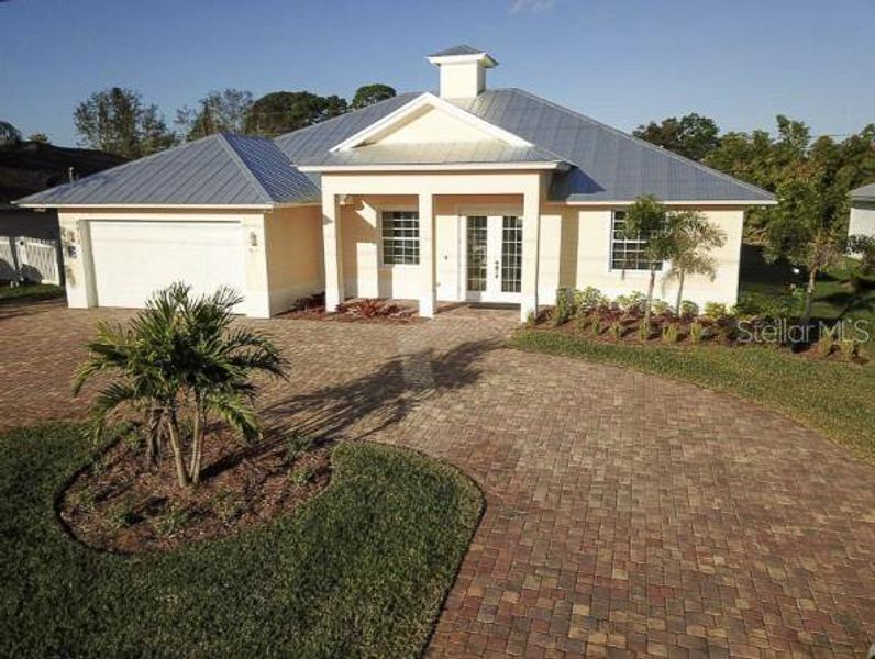 Front exterior of a new home in , Okeechobee, FL, highlighting curb appeal (Image 1). Front exterior of a new home in , Okeechobee, FL, highlighting curb appeal (Image 1).