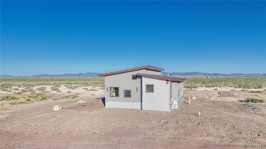 Looking West/East Side of House