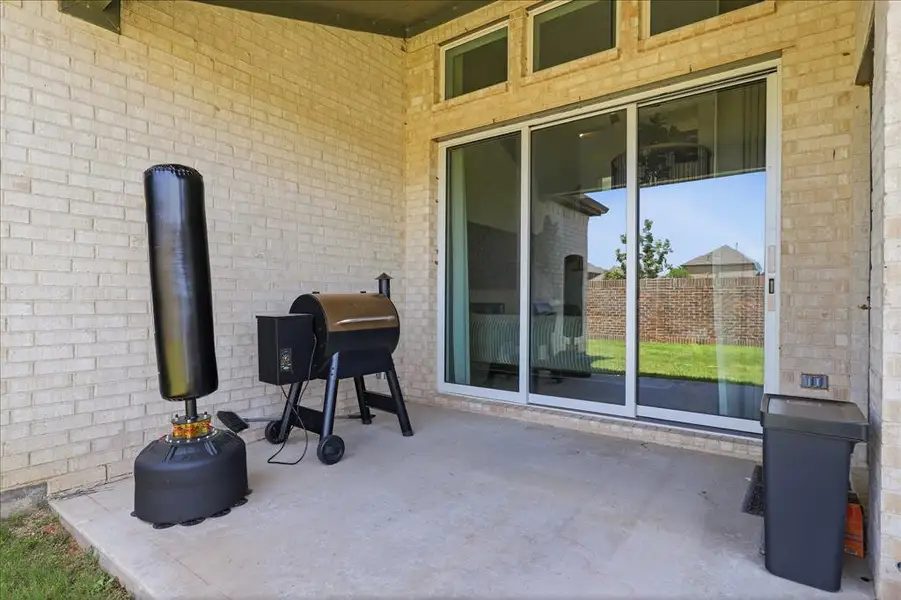Exterior details and patio area of a home in Valencia on The Lake, Little Elm (Image 4).