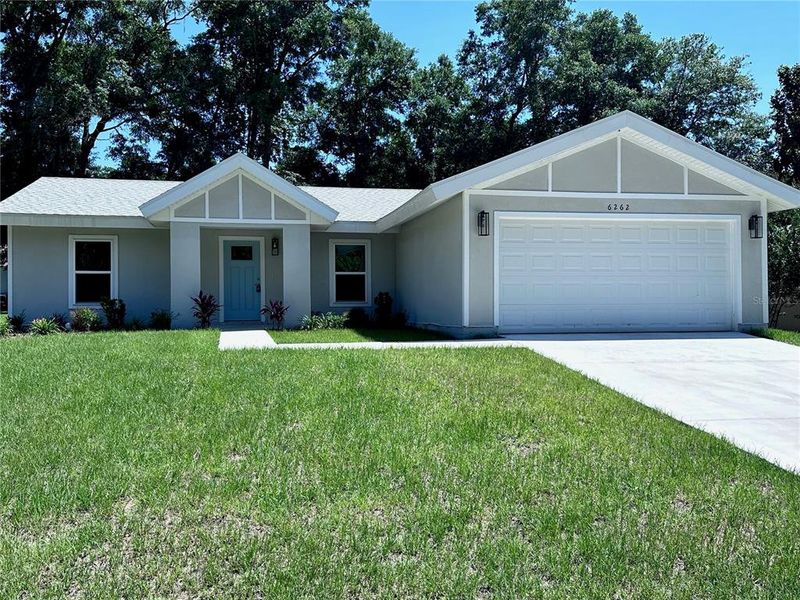 Front exterior of a new home in , Ocala, FL, highlighting curb appeal (Image 1).