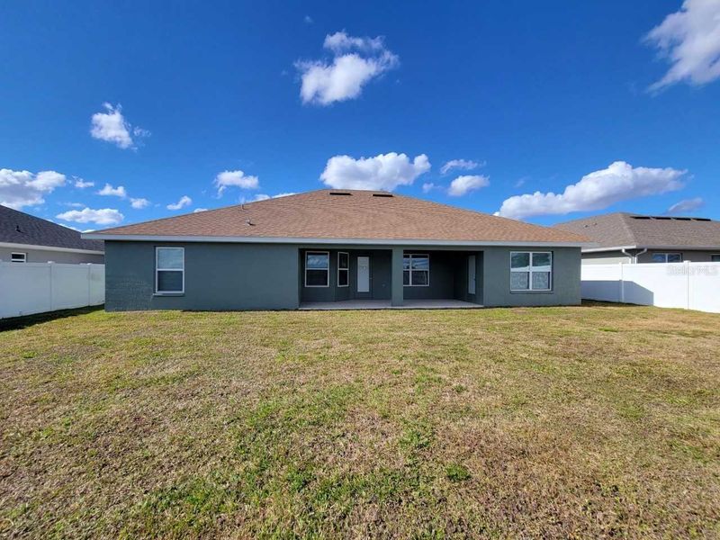 Exterior details and patio area of a home in Ocala Crossings South, Ocala (Image 16).