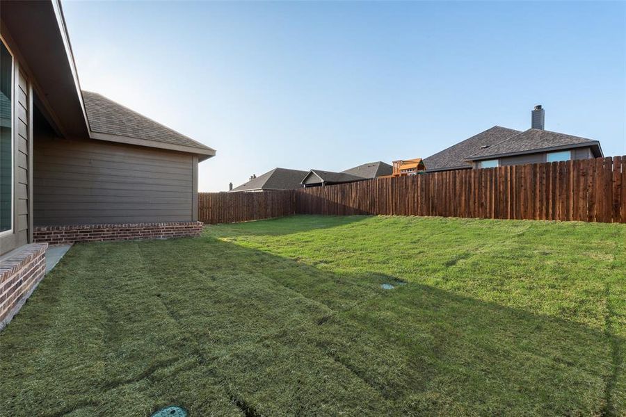 Front exterior of a new home in Liberty Pointe, Gainesville, TX, highlighting curb appeal (Image 17). Front exterior of a new home in Liberty Pointe, Gainesville, TX, highlighting curb appeal (Image 17).