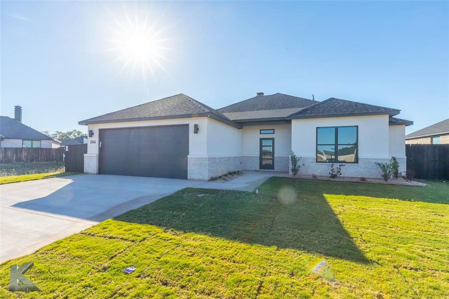 Front exterior of a new home in , Abilene, TX, highlighting curb appeal (Image 2). Front exterior of a new home in , Abilene, TX, highlighting curb appeal (Image 2).