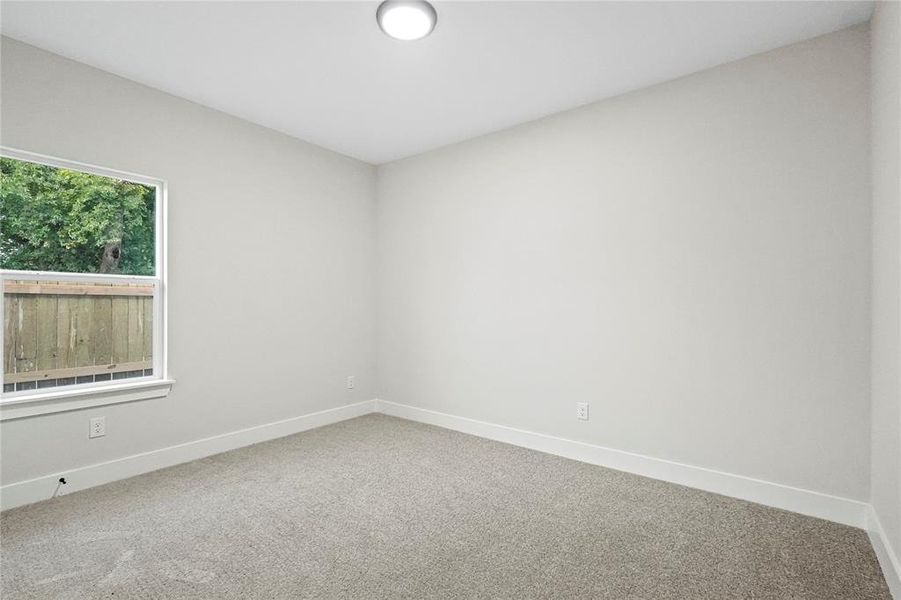 Unfurnished room with carpet flooring