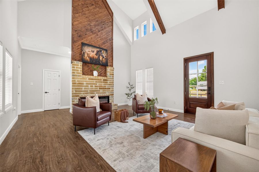 Dramatic living room featuring soaring 22-foot cathedral ceilings and an expansive open-concept design.