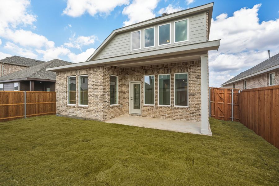 Exterior details and patio area of a home in Walden Pond, Forney (Image 19).