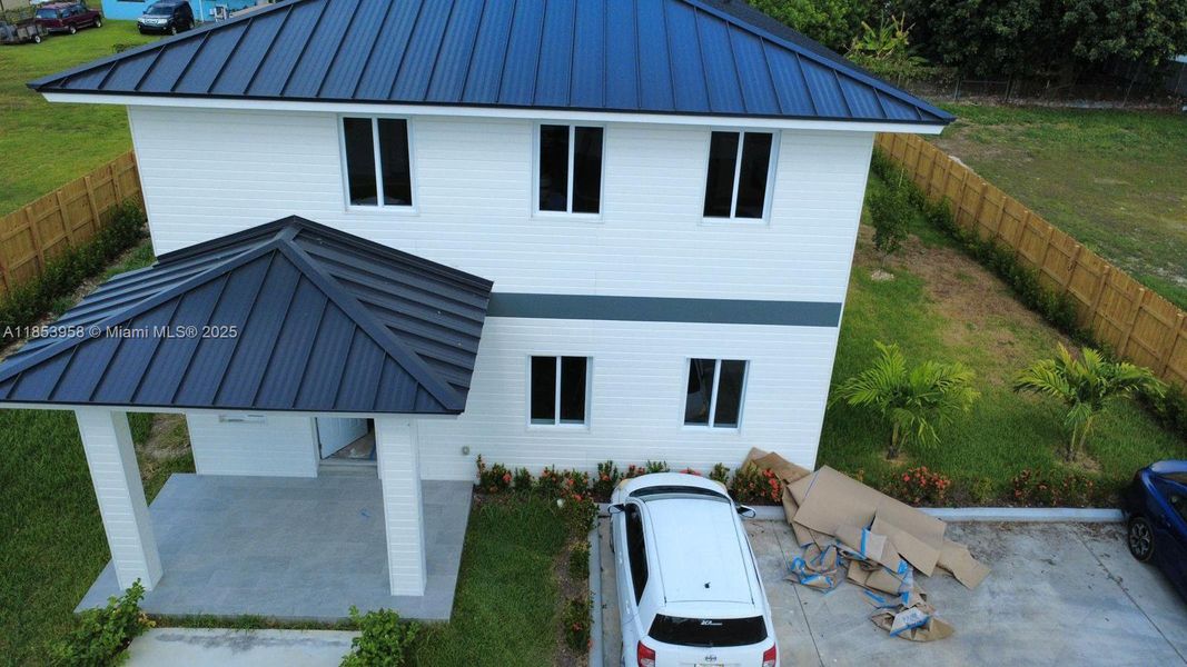 Front exterior of a new home in , Florida City, FL, highlighting curb appeal (Image 1). Front exterior of a new home in , Florida City, FL, highlighting curb appeal (Image 1).