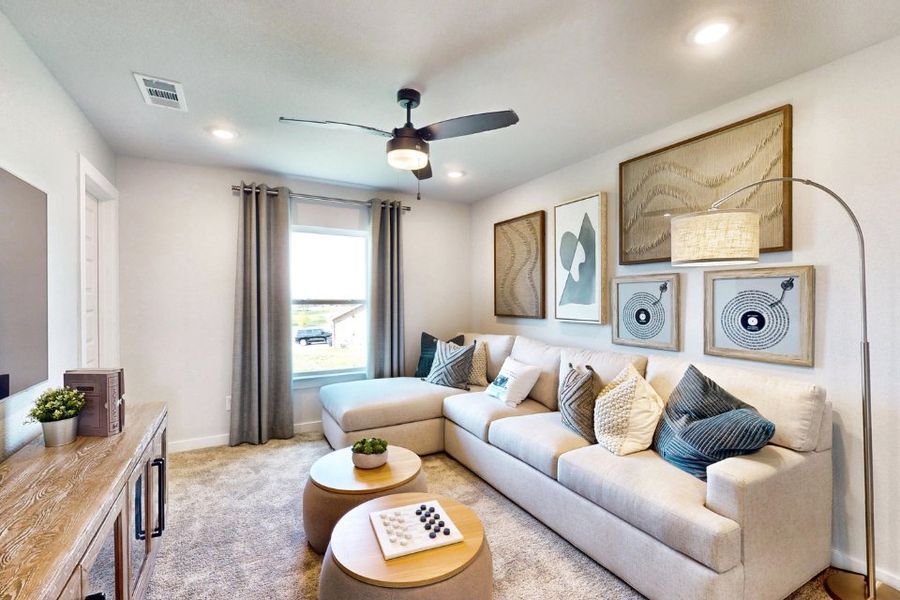 A living room with a couch and a table.