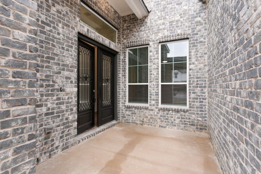 Exterior details and patio area of a home in The Grove at Blackhawk, Pflugerville (Image 3).