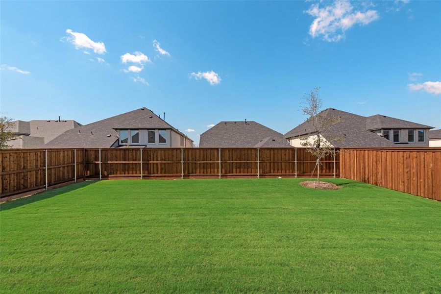 Exterior details and patio area of a home in Spiritas Ranch, Little Elm (Image 16).