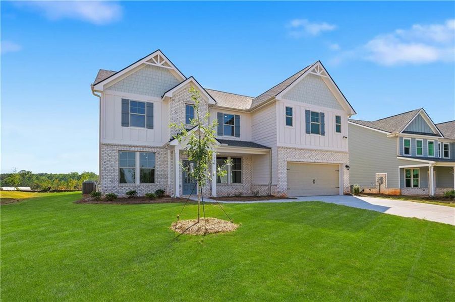 Front exterior of a new home in Brighton, Locust Grove, GA, highlighting curb appeal (Image 16). Front exterior of a new home in Brighton, Locust Grove, GA, highlighting curb appeal (Image 16).