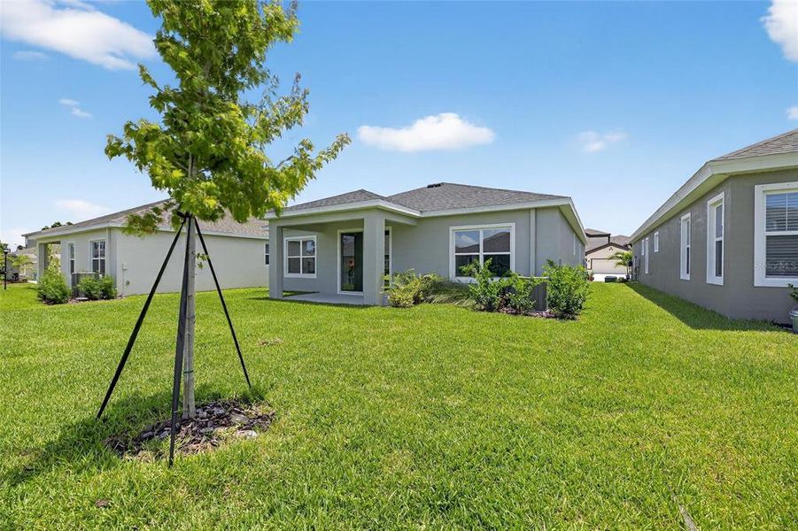 Front exterior of a new home in Waterset, Apollo Beach, FL, highlighting curb appeal (Image 21).
