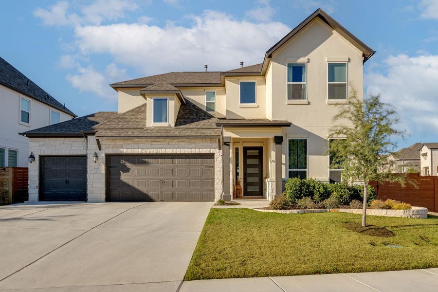 Front exterior of a new home in , Leander, TX, highlighting curb appeal (Image 2). Front exterior of a new home in , Leander, TX, highlighting curb appeal (Image 2).