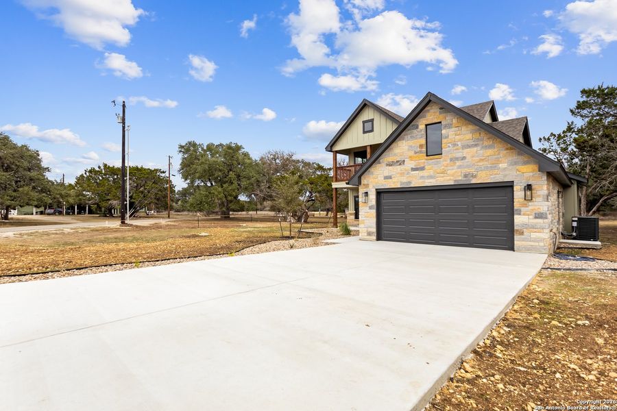 Front exterior of a new home in , Bandera, TX, highlighting curb appeal (Image 2). Front exterior of a new home in , Bandera, TX, highlighting curb appeal (Image 2).